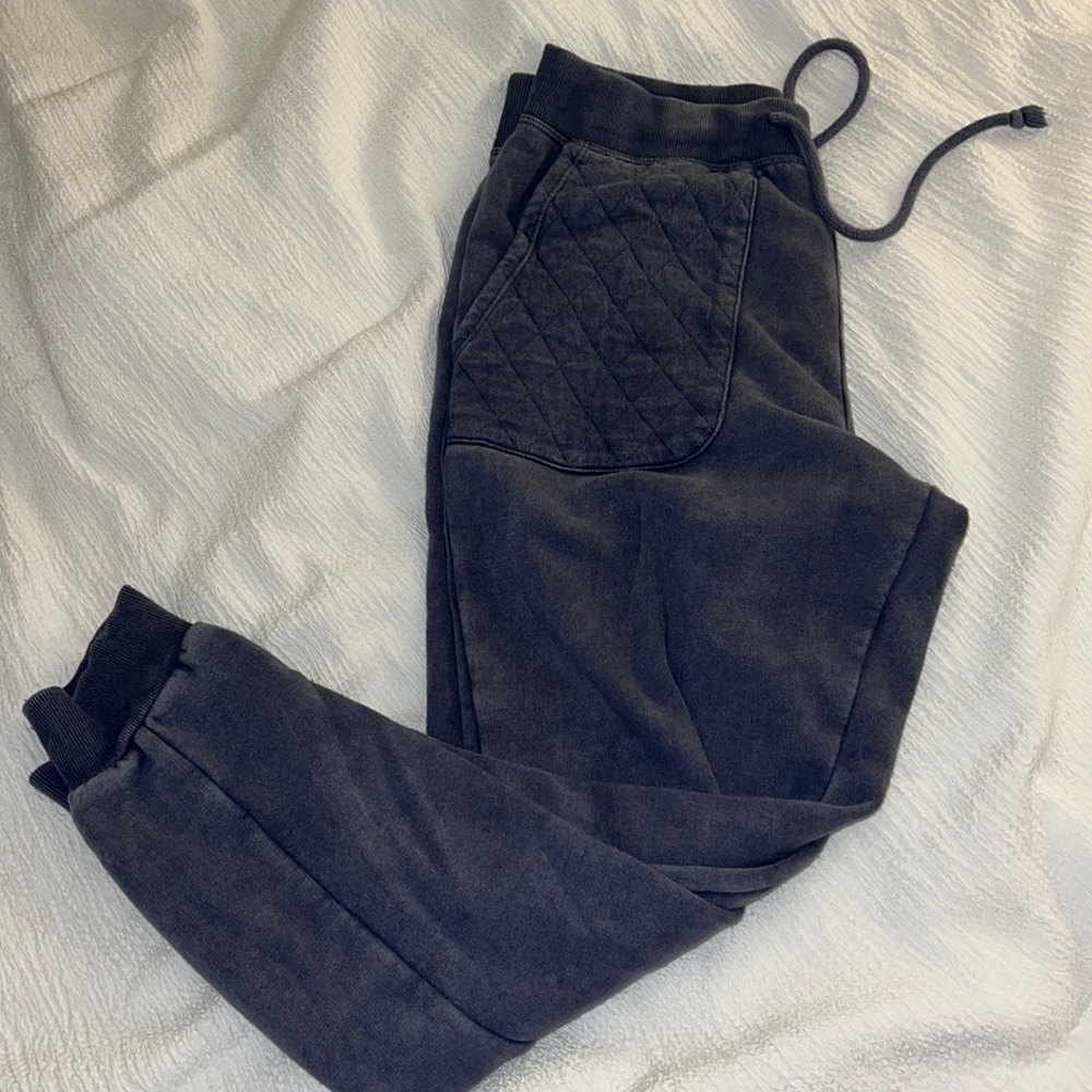 navy blue sweatpants with a patterned pocket